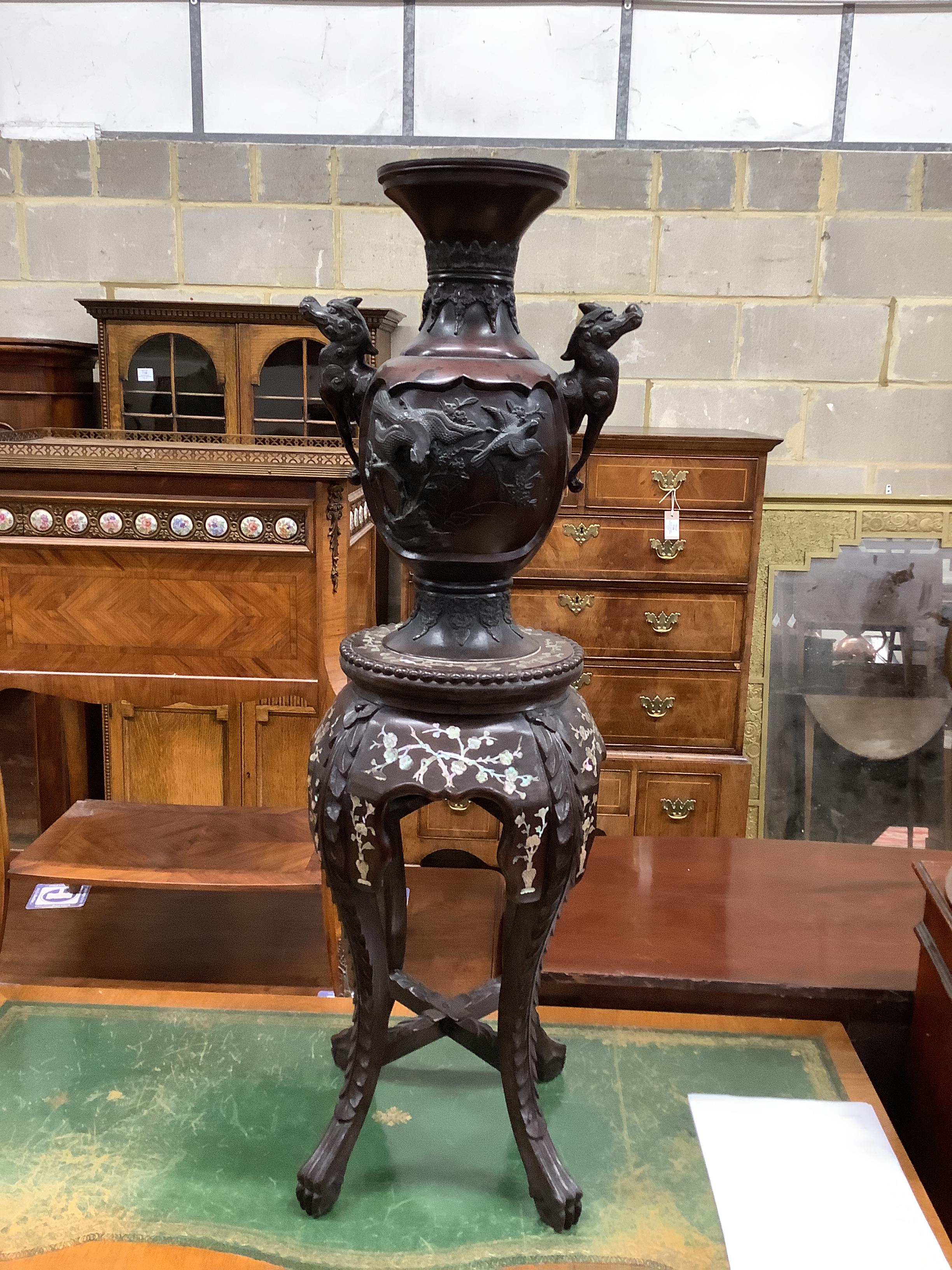 A Chinese circular marble topped vase stand, height 56cm together with a Japanese bronze two handled vase